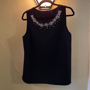 Sleeveless evening top with pearl and bejeweled detail